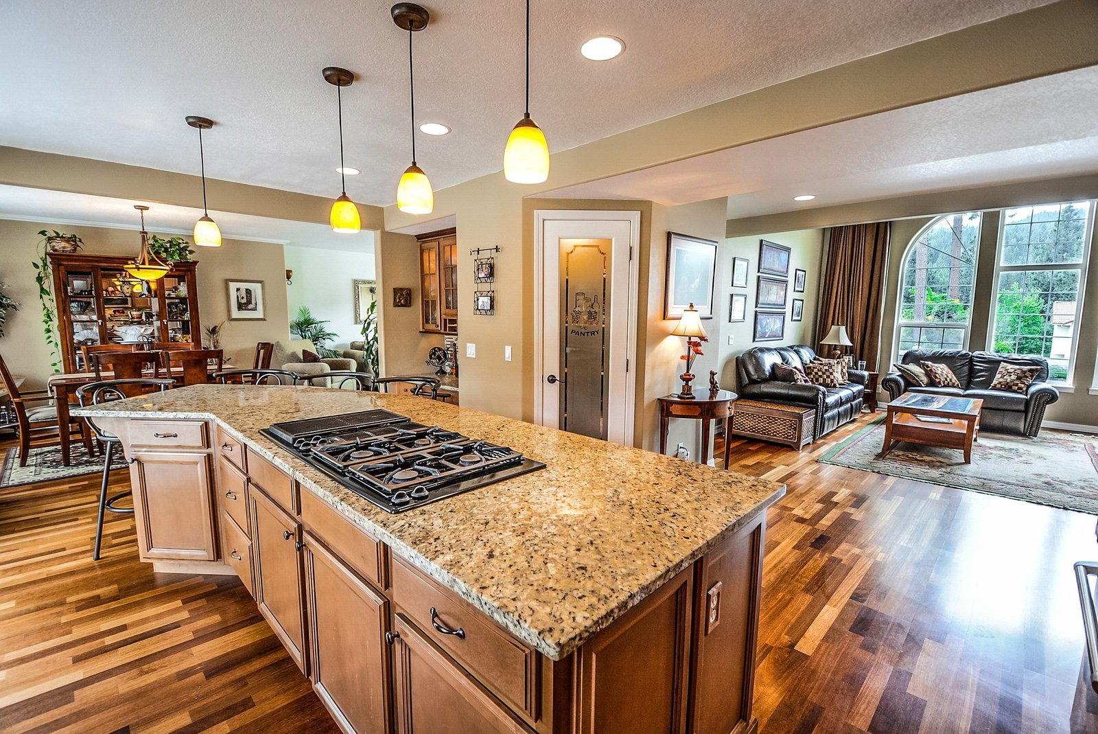 Warm pendant lights over a kitchen island